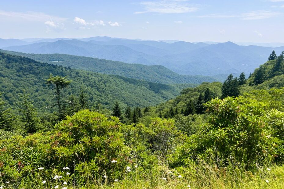Expansive view across mountain ridges and valleys, symbolizing exploration and discovery.