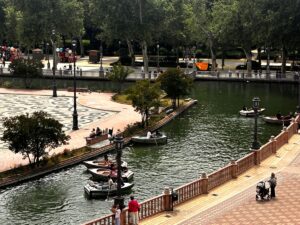 Canal at Plaza de España with small rowboats and arched bridges