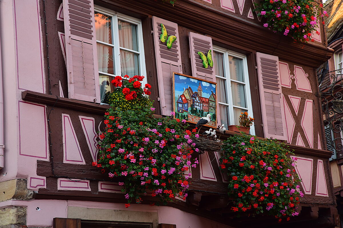 Pictures and statuettes on houses and store fronts tell a story