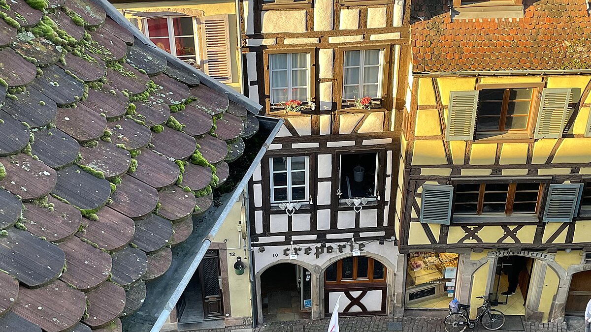 View from an Airbnb overlooking a historic street in Colmar's old town.